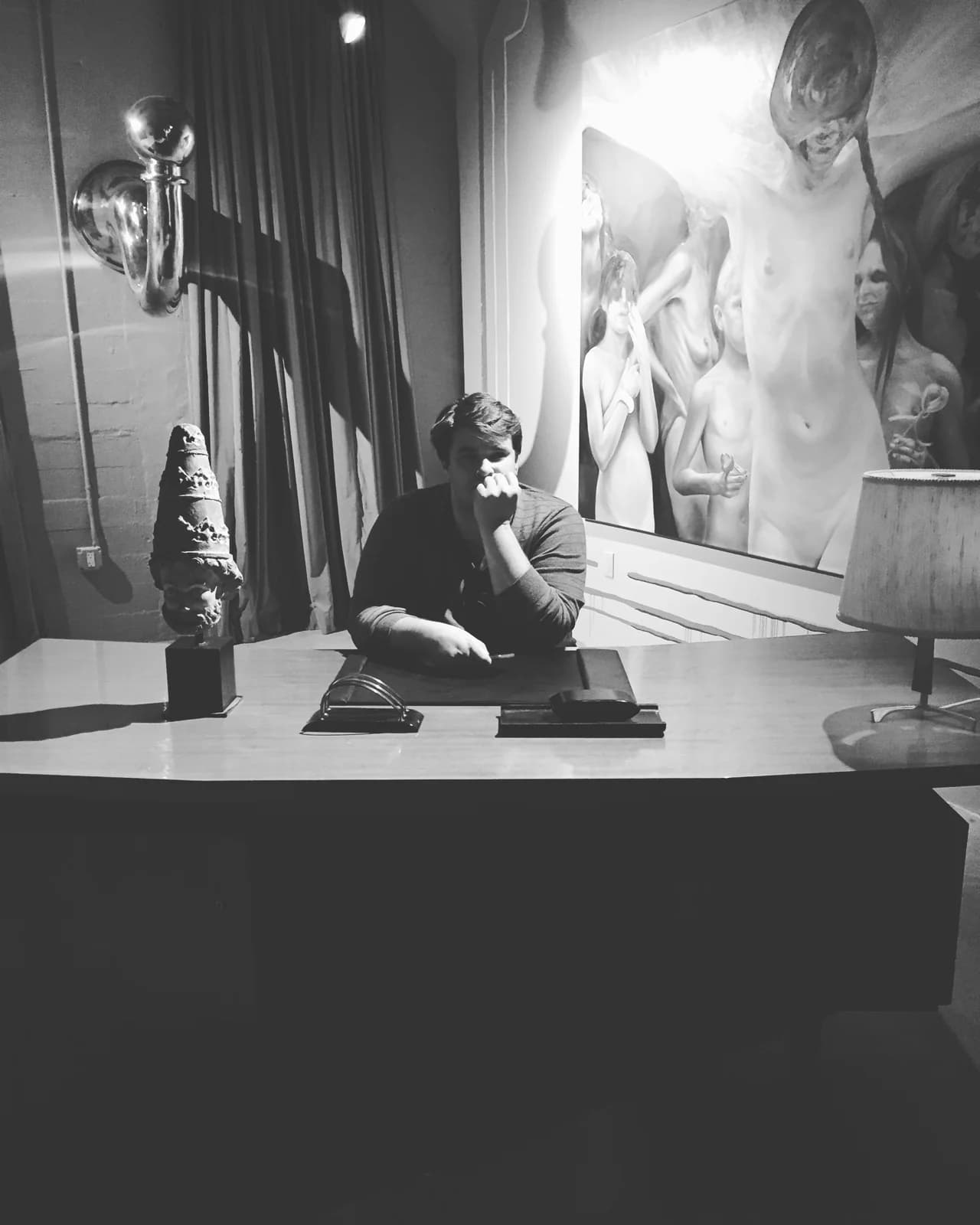 Jon looking at sculptures and paintings in an art gallery